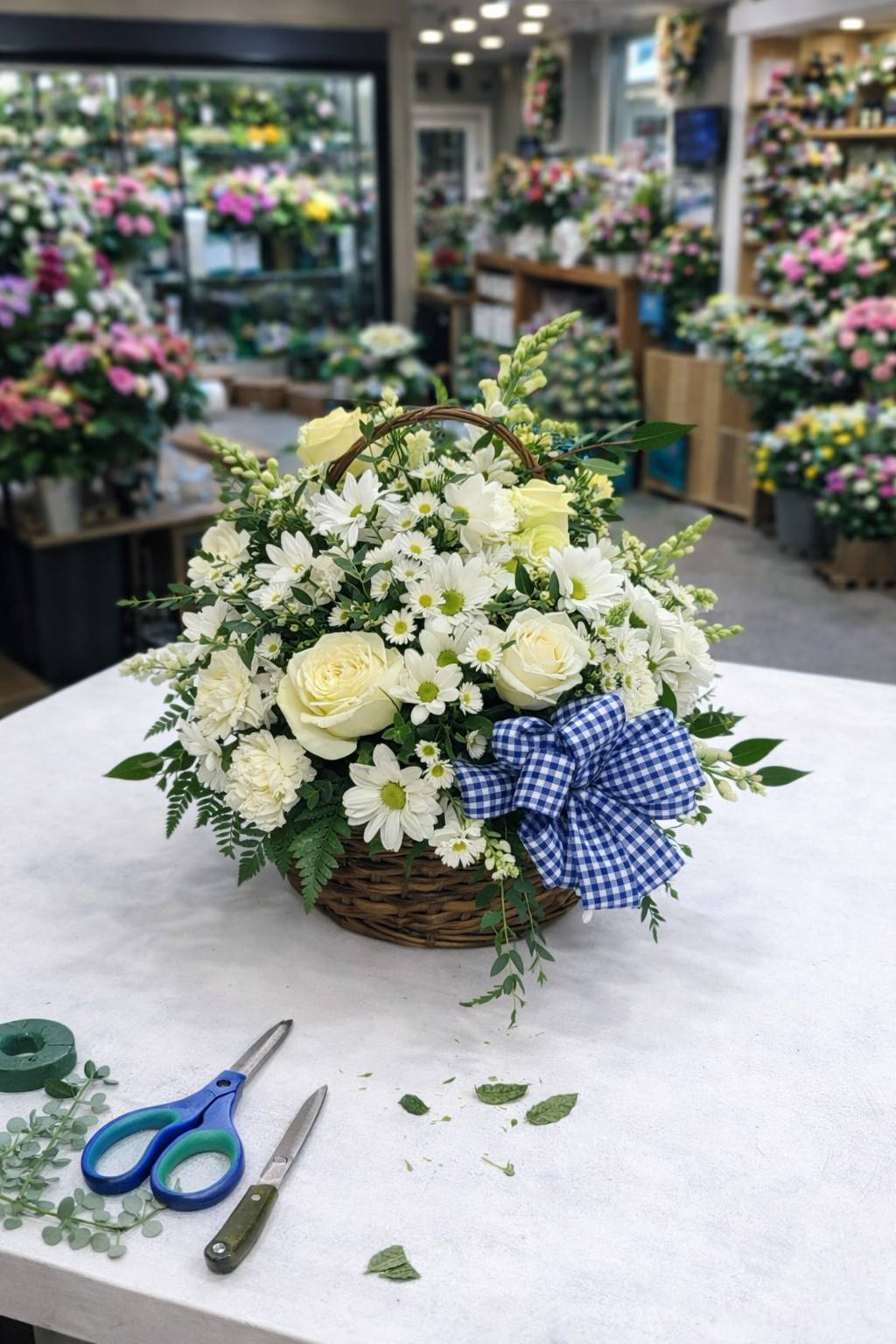 White roses paired with fresh daisies and greenery